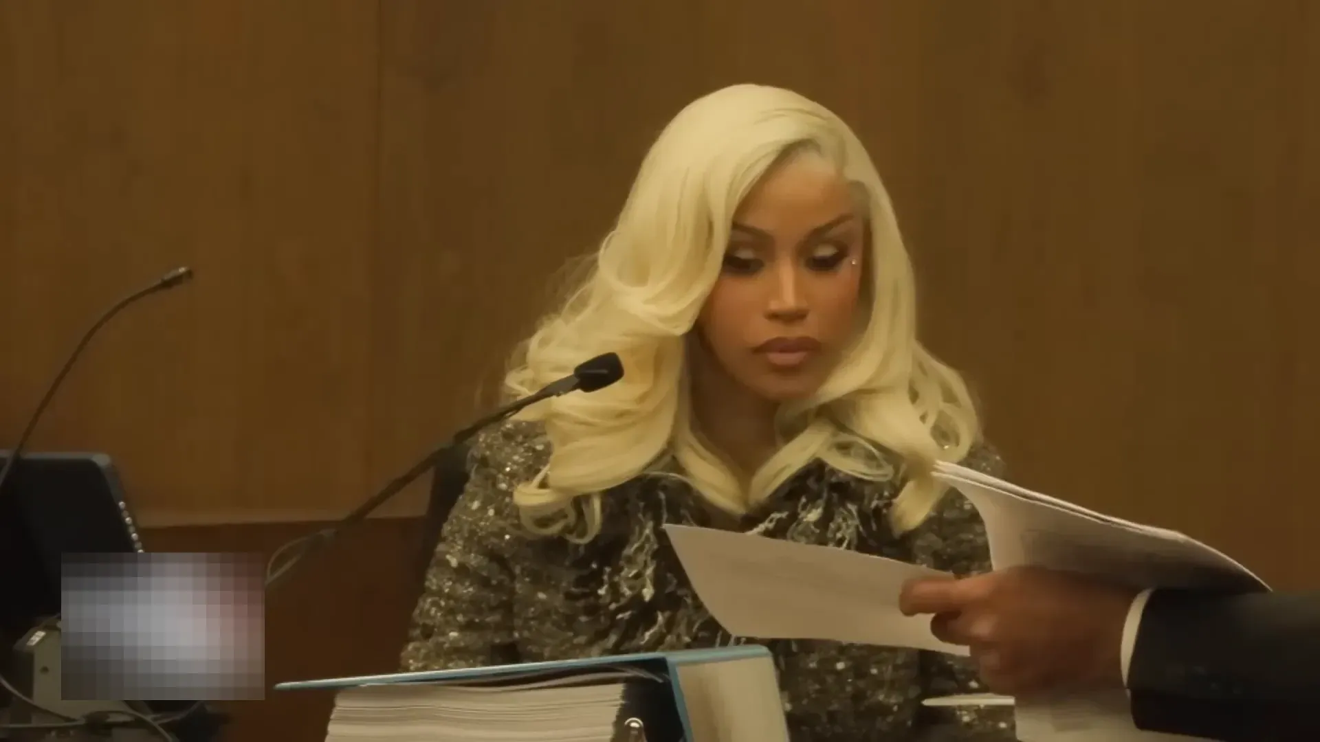 Cardi B shown a document and asked about her signature