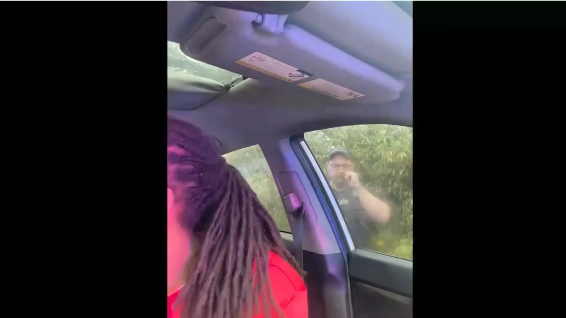 Motorist's dashcam showing the officer breaking the window