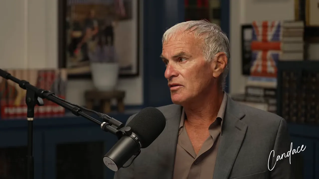Podcast guest looking thoughtful while speaking into a studio microphone