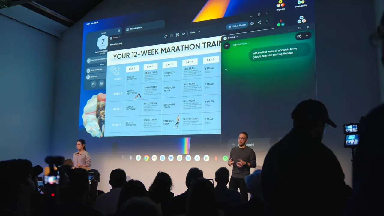 Googlebook desktop projected on stage with a half-marathon training plan and a Gemini panel