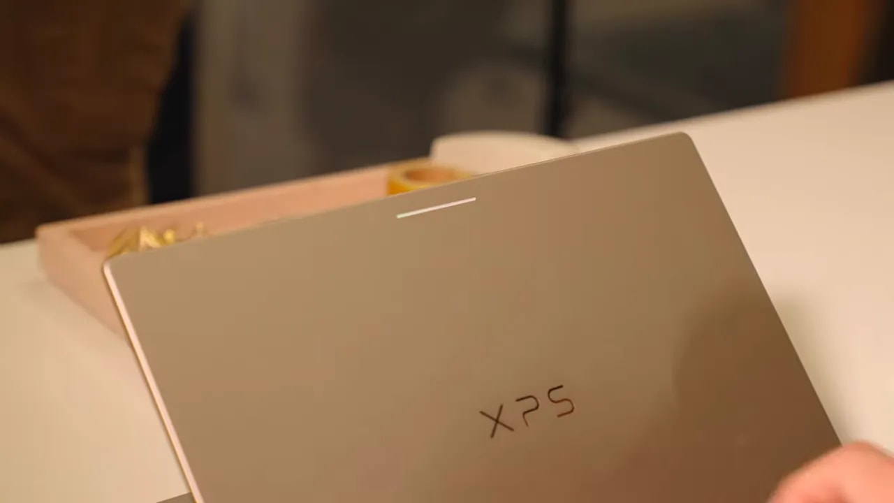 Close-up of the Dell XPS Googlebook lid with the XPS logo and a glowing multicolor bar near the top edge