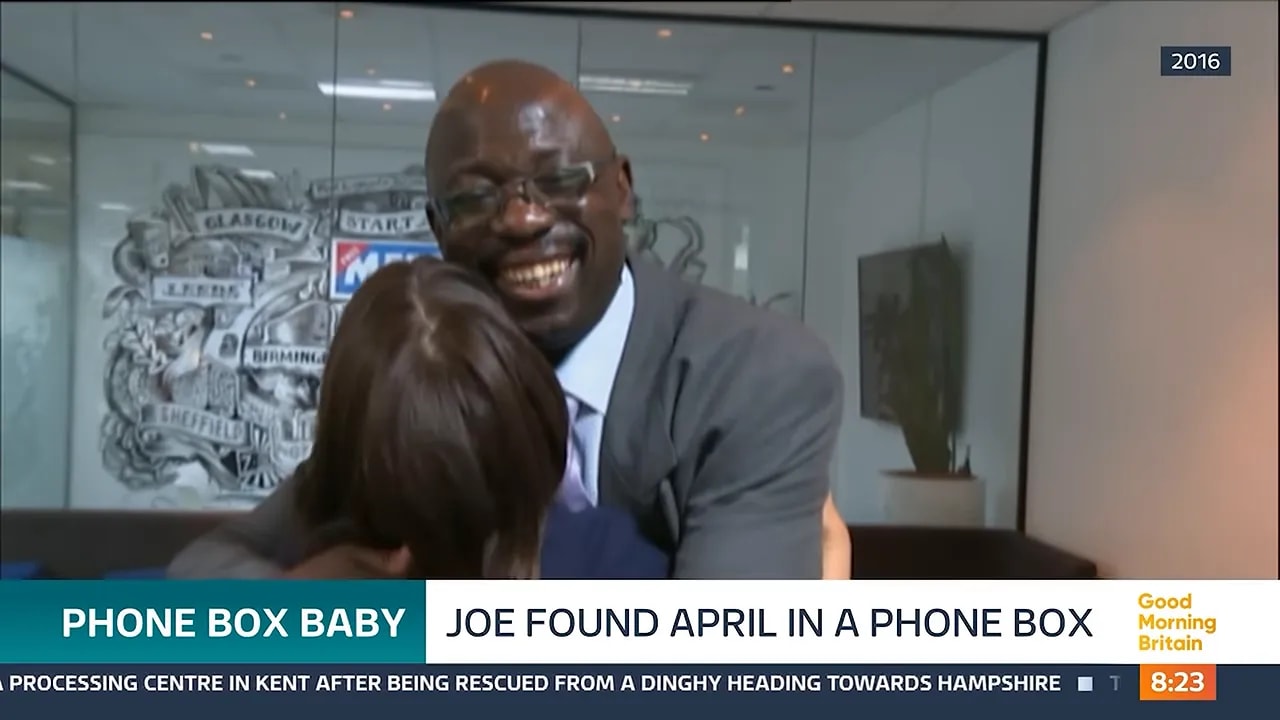 Joe Campbell smiling as he embraces April during their 2016 reunion