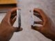 Two folded phones held side by side with their edges facing the camera