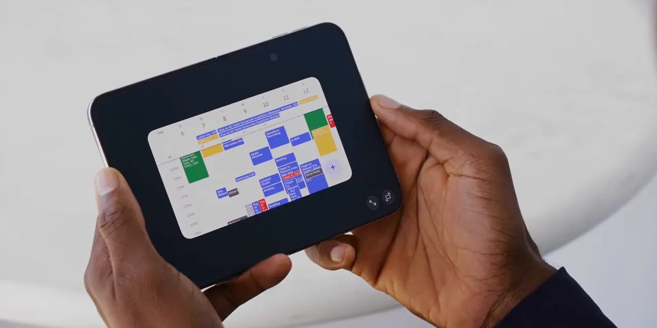 An unfolded phone showing a small calendar app surrounded by wide black borders